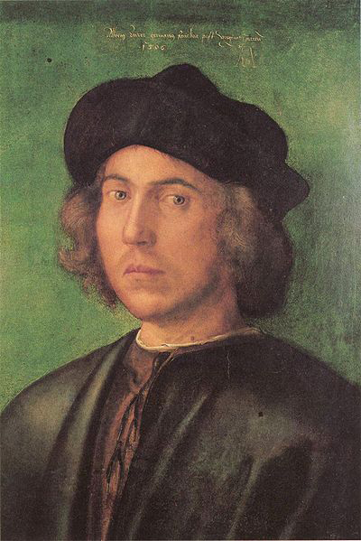 Portrat eines jungen Mannes vor grunem Hintergrund